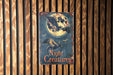 a sign on a wooden wall that says night creatures