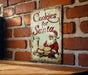a sign on a brick wall that says cookies for santa