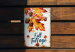 a sign on a wooden bench that says fall foliage