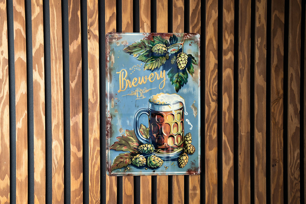 a metal sign with a mug of beer on it