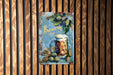 a metal sign with a mug of beer on it