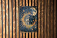 a picture of a woman's face on a wood paneled wall
