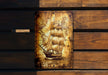 a picture of a ship on a wooden wall