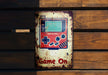 a game on sign on a wooden wall