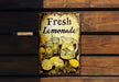 a sign that says fresh lemonade on it