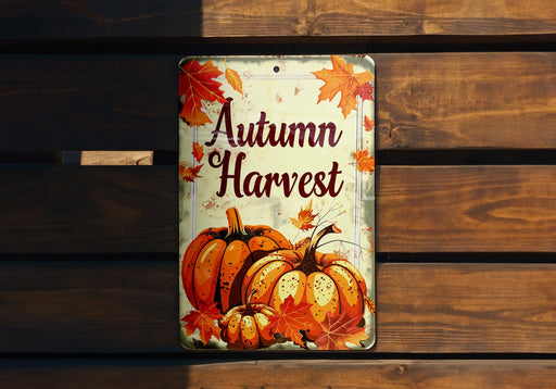 a metal sign that says autumn harvest on it