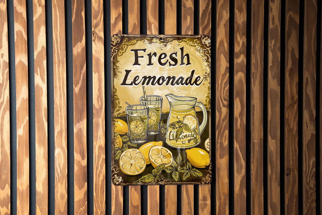 a sign on a wall that says fresh lemonade