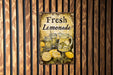 a sign on a wall that says fresh lemonade