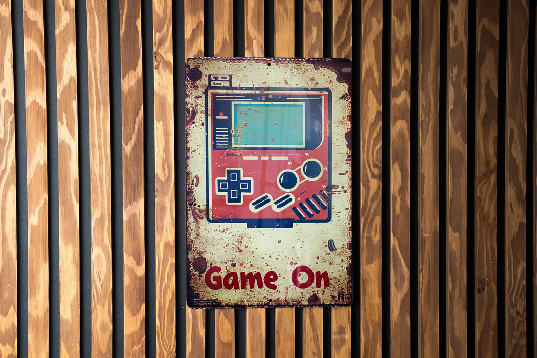 a game on sign on a wooden wall