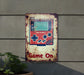 a game on sign on the side of a building