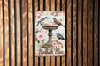 a painting of two birds on a bird bath