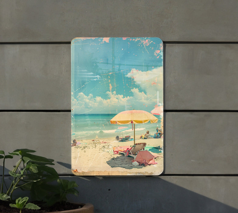 a picture of a beach with a yellow umbrella