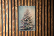 a picture of a christmas tree hanging on a wall