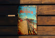 a book sitting on top of a wooden bench