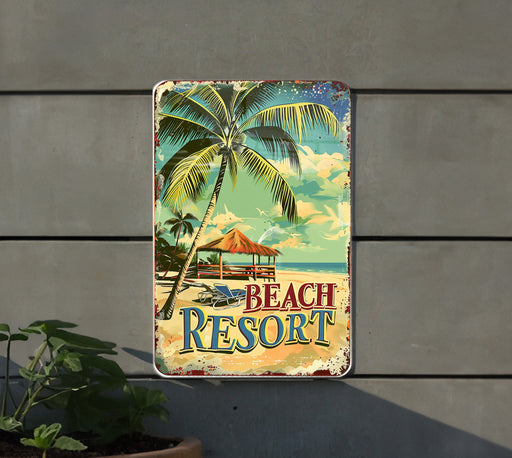 a beach resort sign hanging on the side of a building