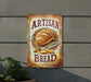 a sign on the side of a building advertising bread
