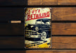 a metal sign that says auto detailing on it