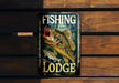 a sign on the side of a building that says fishing lodge