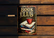 a book club sign on a wooden bench
