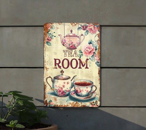 a tea room sign hanging on the side of a building