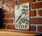 a picture of a bird on a brick wall