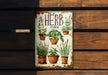 a tin sign with a picture of herbs on it