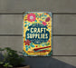 a sign that says craft supplies hanging on the side of a building