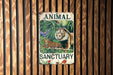 an animal sanctuary sign on a wooden wall