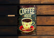 a sign that says coffee house on it