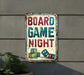a sign that says board game night on it