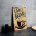 a coffee break sign sitting on top of a table