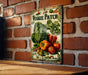 a vegetable patch sign on a brick wall