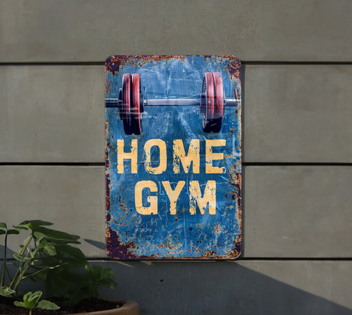 a sign that says home gym hanging on a wall