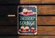 a sign that says dessert lounge with cupcakes on it