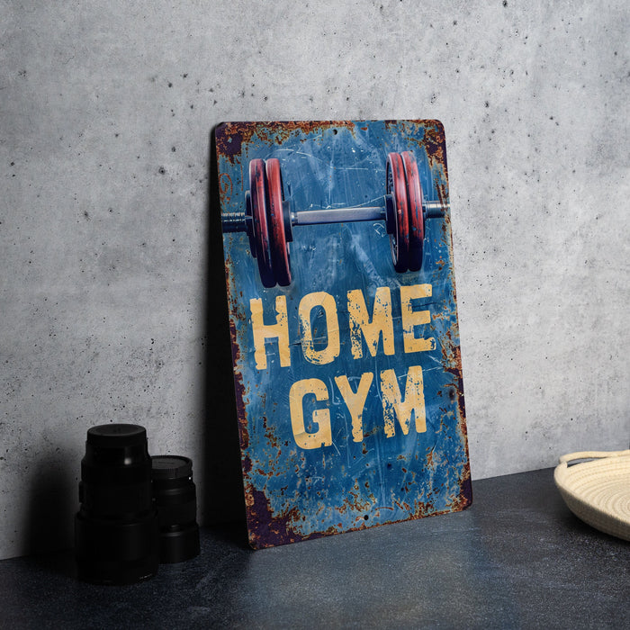 a sign that says home gym next to a pair of dumbs
