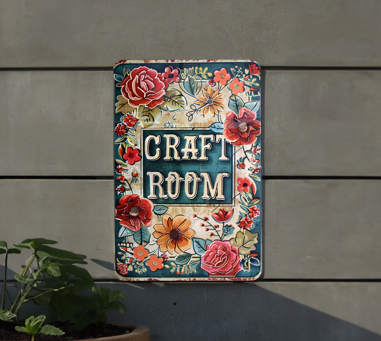 a sign that says craft room hanging on the side of a building