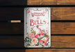 a wedding bells sign on a wooden bench