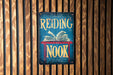 a sign reading nook on a wooden wall