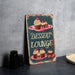 a sign that says dessert lounge with cupcakes on it