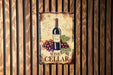 a wine cellar sign hanging on a wooden wall