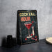 a metal sign that says cocktail hour on it