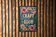 a sign on a wooden wall that says craft room