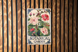 a botanical garden sign hanging on a wooden wall