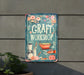 a sign on the side of a building that says craft workshop