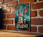 a sign on a brick wall that says art studio