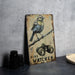 a bird sitting on top of a wooden sign
