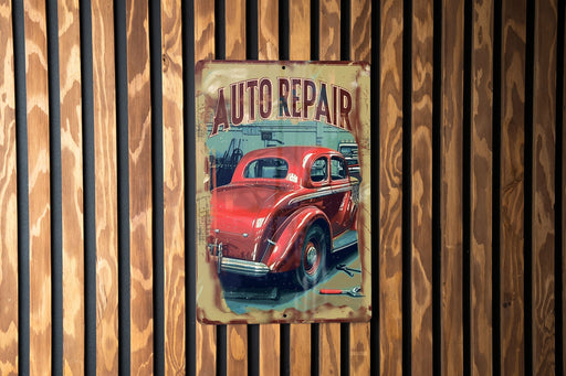 a red car sitting on top of a wooden wall