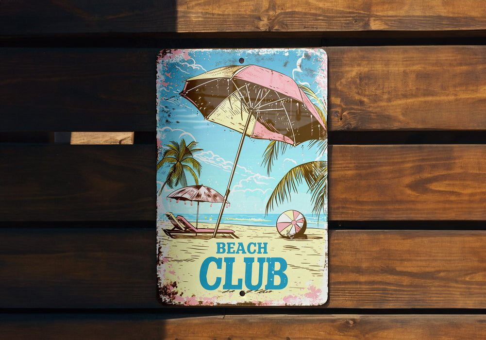 a beach club sign on a wooden bench