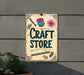 a sign that says craft store hanging on a wall