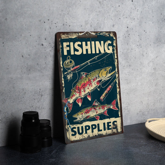 a fishing sign on a table next to a pair of binoculars